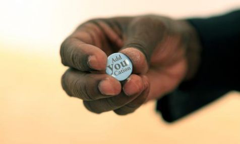 Hand of Bishop Adanuty with button